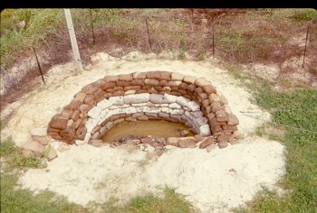 Danang VN foxhole afer the typhoon 1964.jpg