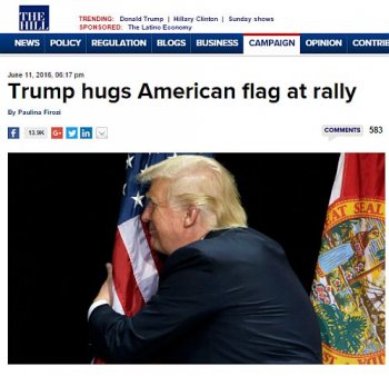 Trump-hugs-flag.jpg