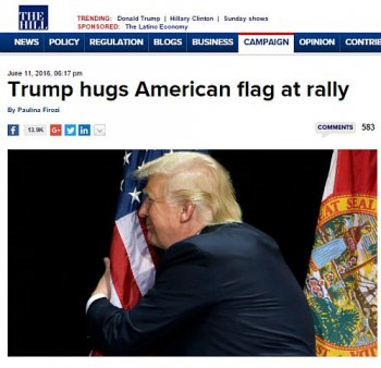 Trump-hugs-flag.jpg