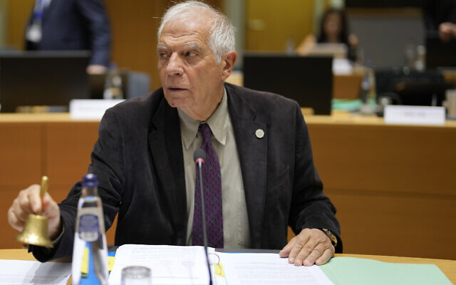 European Union foreign policy chief Josep Borrell rings a bell to signify the start of a meeting of EU foreign ministers at the European Council building in Brussels, November 13, 2023.  (AP Photo/Virginia Mayo)