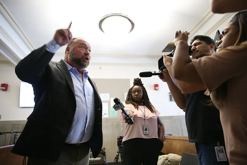 alex-jones-talks-to-reporters.jpg