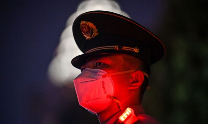 A Chinese paramilitary police stands guard on the Bund waterfront during China's National Day celebrations in Shanghai on October 1, 2022.(Hector Retamal/AFP via Getty Images)