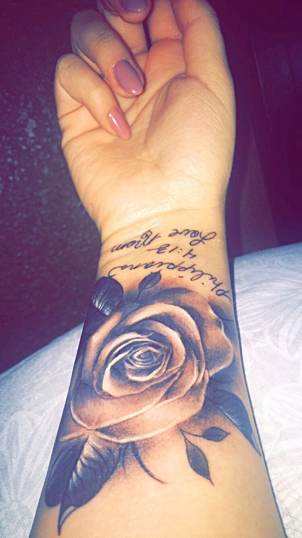 Charming-rose-flower-and-scripture-tattoo-on-wrist.jpg