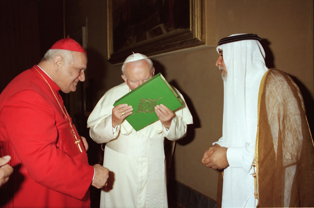 Pope-John-Paul-II-center-kisses-the-the-Quran-Islam-s-Holy-book-in-this-May-14-1999-picture-taken-at.jpg