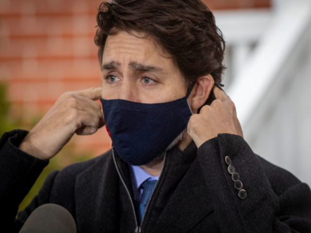 Justin-Trudeau-putting-on-mask-getty-640x480.jpg