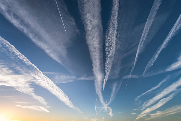 cloudscape-showing-trails-left-by-airplanes-picture-id628153742