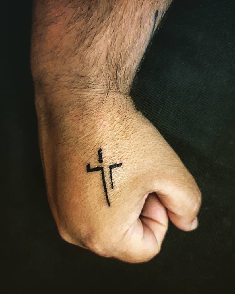 Small-Cross-Hand-Finger-Tattoo-margarispiros.jpg