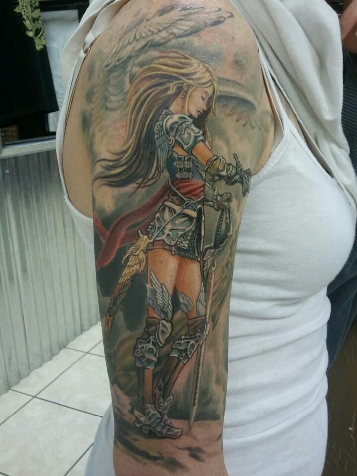 Color-Warrior-Angel-Tattoo-On-Girl-Right-Sleeve.jpg